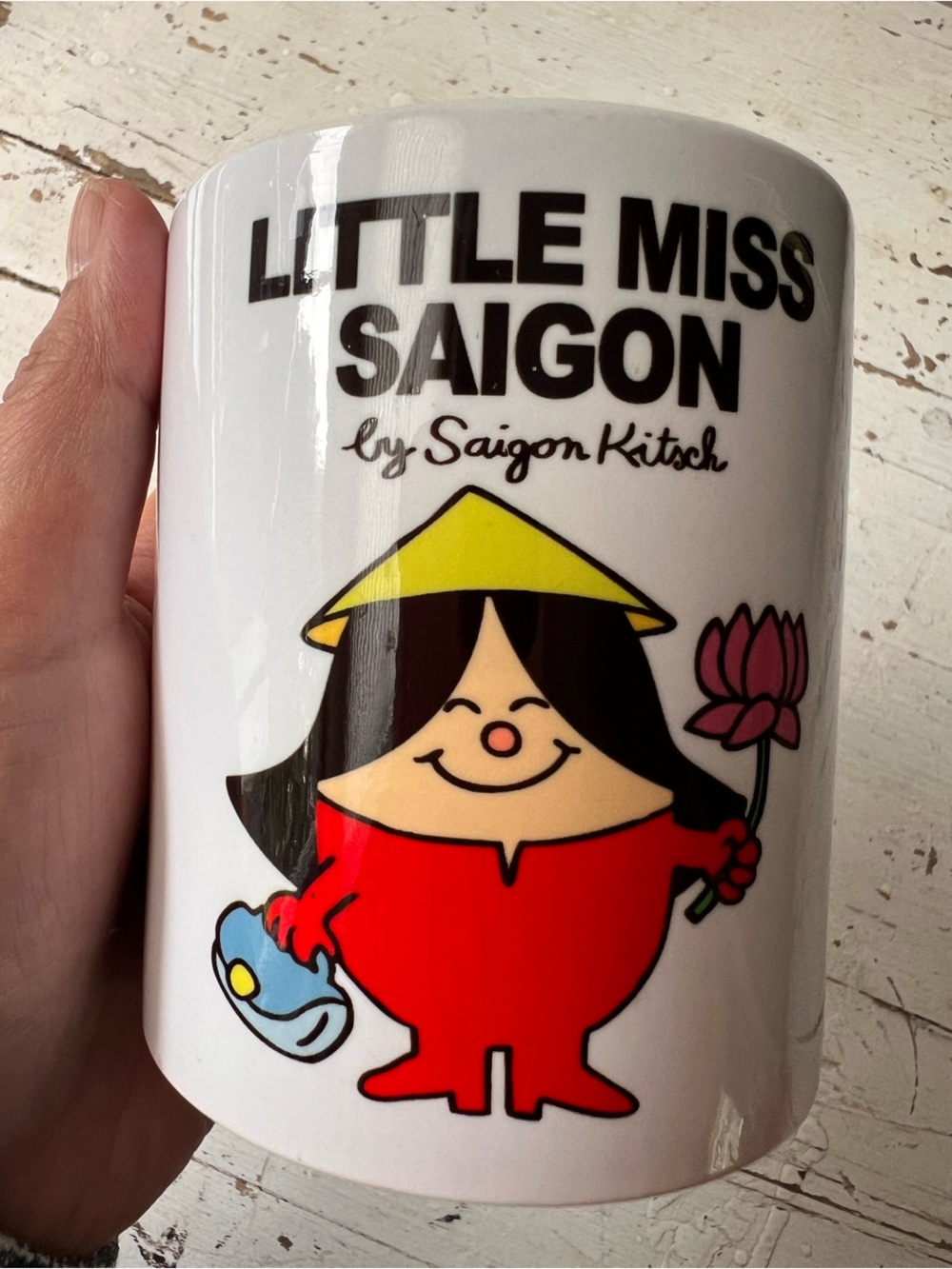 Little Miss Saigon by Saigon Kitsch White Ceramic Mug with Red Character